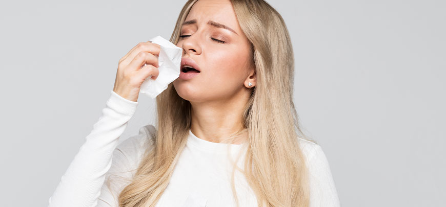 Woman suffering with allergies