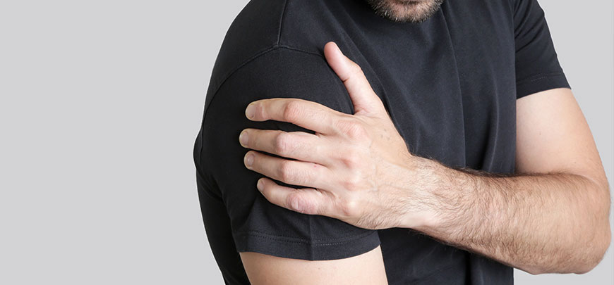 Male patient suffering with frozen shoulder