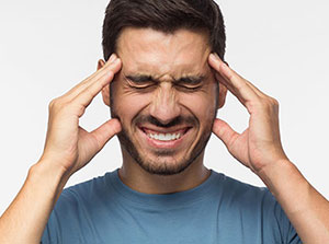 Man suffering with from headaches