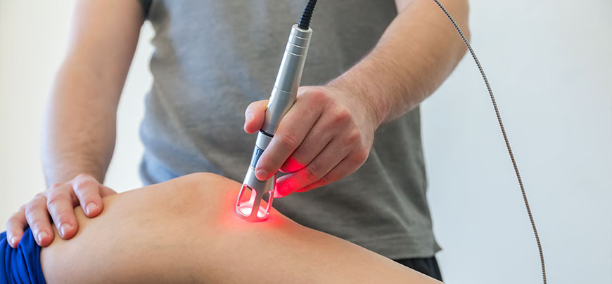 Man recieving K-Laser therapy for knee pain